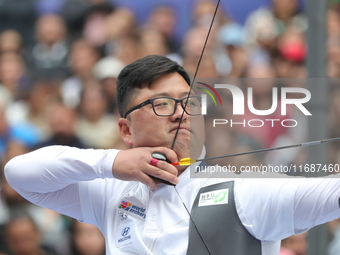 Kim Woojin of Korea competes against Matias Grande of Mexico (not in picture) during the Men's recurve semifinals match on the final day of...