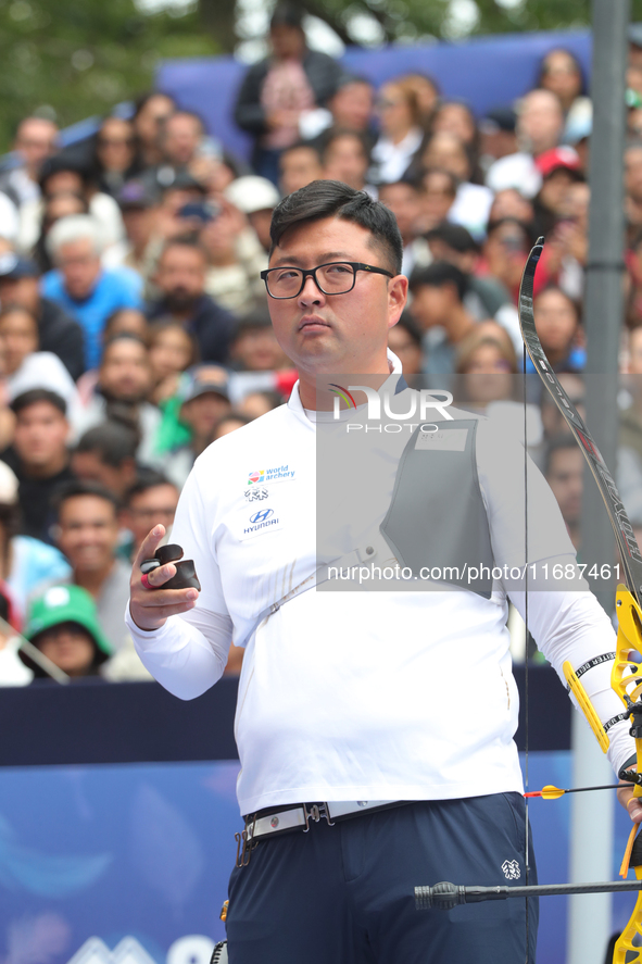 Kim Woojin of Korea competes against Matias Grande of Mexico (not in picture) during the Men's recurve semifinals match on the final day of...