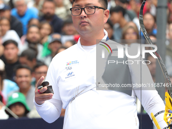 Kim Woojin of Korea competes against Matias Grande of Mexico (not in picture) during the Men's recurve semifinals match on the final day of...