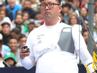 Kim Woojin of Korea competes against Matias Grande of Mexico (not in picture) during the Men's recurve semifinals match on the final day of...