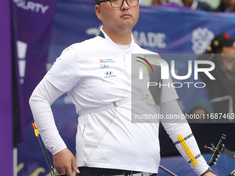 Kim Woojin of Korea competes against Matias Grande of Mexico (not in picture) during the Men's recurve semifinals match on the final day of...