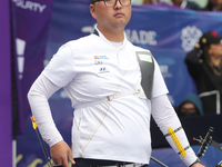 Kim Woojin of Korea competes against Matias Grande of Mexico (not in picture) during the Men's recurve semifinals match on the final day of...