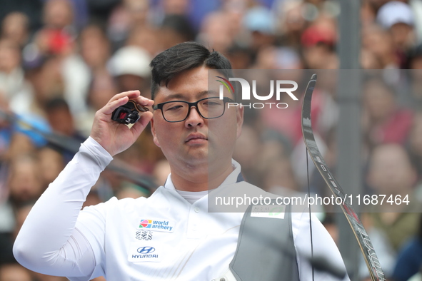 Kim Woojin of Korea competes against Matias Grande of Mexico (not in picture) during the Men's recurve semifinals match on the final day of...