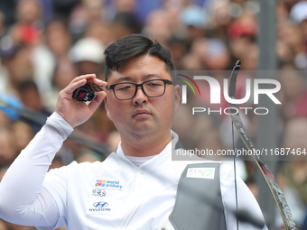 Kim Woojin of Korea competes against Matias Grande of Mexico (not in picture) during the Men's recurve semifinals match on the final day of...