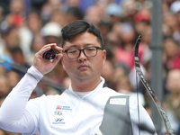 Kim Woojin of Korea competes against Matias Grande of Mexico (not in picture) during the Men's recurve semifinals match on the final day of...