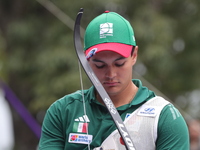 Matias Grande of Mexico competes against Kim Woojin of Korea (not in picture) during the Men's recurve semifinals match on the final day of...