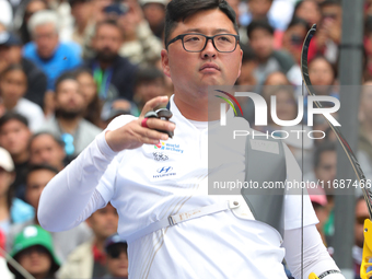 Kim Woojin of Korea competes against Matias Grande of Mexico (not in picture) during the Men's recurve semifinals match on the final day of...