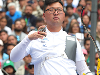 Kim Woojin of Korea competes against Matias Grande of Mexico (not in picture) during the Men's recurve semifinals match on the final day of...