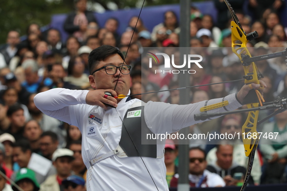 Kim Woojin of Korea competes against Matias Grande of Mexico (not in picture) during the Men's recurve semifinals match on the final day of...