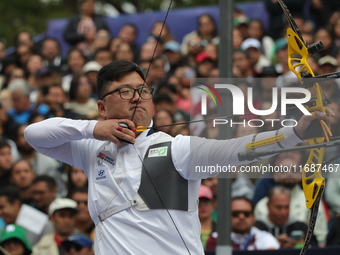 Kim Woojin of Korea competes against Matias Grande of Mexico (not in picture) during the Men's recurve semifinals match on the final day of...