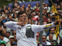 Kim Woojin of Korea competes against Matias Grande of Mexico (not in picture) during the Men's recurve semifinals match on the final day of...