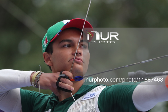 Matias Grande of Mexico competes against Kim Woojin of Korea (not in picture) during the Men's recurve semifinals match on the final day of...