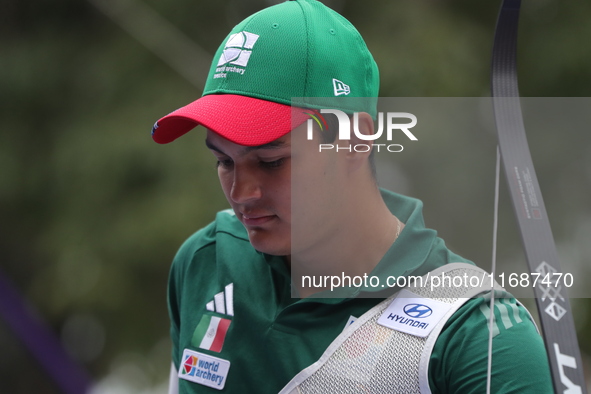 Matias Grande of Mexico competes against Kim Woojin of Korea (not in picture) during the Men's recurve semifinals match on the final day of...