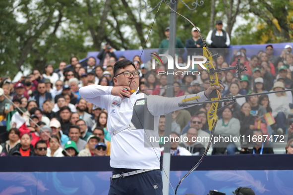 Kim Woojin of Korea competes against Matias Grande of Mexico (not in picture) during the Men's recurve semifinals match on the final day of...