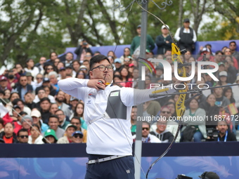 Kim Woojin of Korea competes against Matias Grande of Mexico (not in picture) during the Men's recurve semifinals match on the final day of...