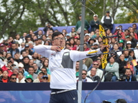 Kim Woojin of Korea competes against Matias Grande of Mexico (not in picture) during the Men's recurve semifinals match on the final day of...