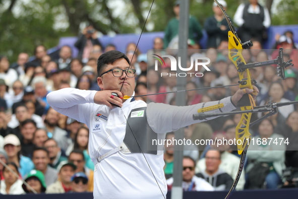 Kim Woojin of Korea competes against Matias Grande of Mexico (not in picture) during the Men's recurve semifinals match on the final day of...