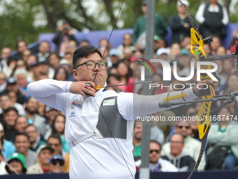 Kim Woojin of Korea competes against Matias Grande of Mexico (not in picture) during the Men's recurve semifinals match on the final day of...