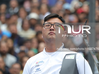 Kim Woojin of Korea competes against Matias Grande of Mexico (not in picture) during the Men's recurve semifinals match on the final day of...