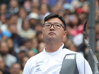 Kim Woojin of Korea competes against Matias Grande of Mexico (not in picture) during the Men's recurve semifinals match on the final day of...