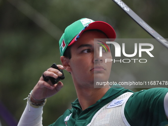 Matias Grande of Mexico competes against Kim Woojin of Korea (not in picture) during the Men's recurve semifinals match on the final day of...