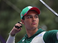 Matias Grande of Mexico competes against Kim Woojin of Korea (not in picture) during the Men's recurve semifinals match on the final day of...