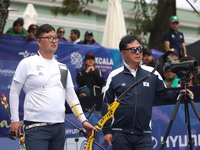 Kim Woojin of Korea competes against Matias Grande of Mexico (not in picture) during the Men's recurve semifinals match on the final day of...