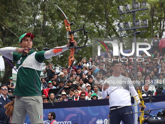 Kim Woojin of Korea and Matias Grande of Mexico compete during the Men's recurve semifinals match on the final day of the Tlaxcala 2024 Arch...