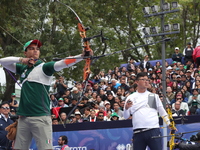 Kim Woojin of Korea and Matias Grande of Mexico compete during the Men's recurve semifinals match on the final day of the Tlaxcala 2024 Arch...