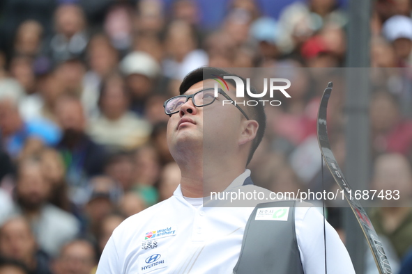 Kim Woojin of Korea competes against Matias Grande of Mexico (not in picture) during the Men's recurve semifinals match on the final day of...