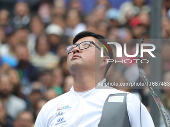 Kim Woojin of Korea competes against Matias Grande of Mexico (not in picture) during the Men's recurve semifinals match on the final day of...