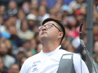 Kim Woojin of Korea competes against Matias Grande of Mexico (not in picture) during the Men's recurve semifinals match on the final day of...