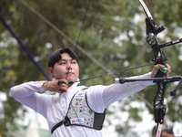 Lee Woo-Seok of Korea competes against Marcus D'Almeida of Brazil (not in picture) during the Men's recurve semifinals match on the final da...