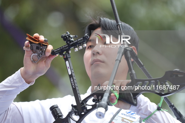 Lee Woo-Seok of Korea competes against Marcus D'Almeida of Brazil (not in picture) during the Men's recurve semifinals match on the final da...