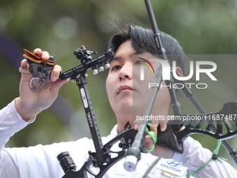 Lee Woo-Seok of Korea competes against Marcus D'Almeida of Brazil (not in picture) during the Men's recurve semifinals match on the final da...