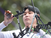 Lee Woo-Seok of Korea competes against Marcus D'Almeida of Brazil (not in picture) during the Men's recurve semifinals match on the final da...