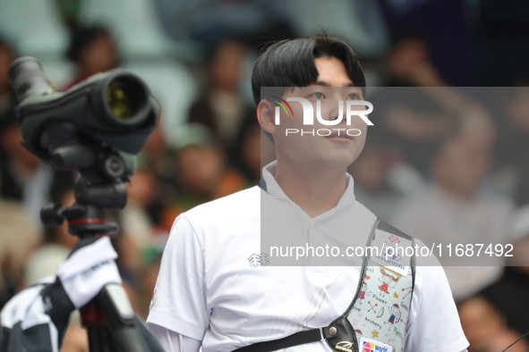 Lee Woo-Seok of Korea competes against Marcus D'Almeida of Brazil (not in picture) during the Men's recurve semifinals match on the final da...