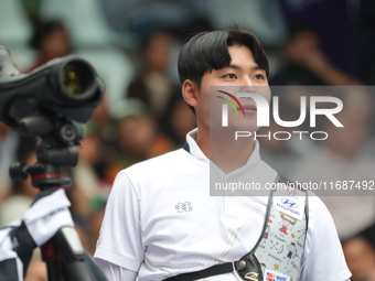 Lee Woo-Seok of Korea competes against Marcus D'Almeida of Brazil (not in picture) during the Men's recurve semifinals match on the final da...