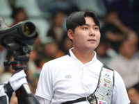 Lee Woo-Seok of Korea competes against Marcus D'Almeida of Brazil (not in picture) during the Men's recurve semifinals match on the final da...