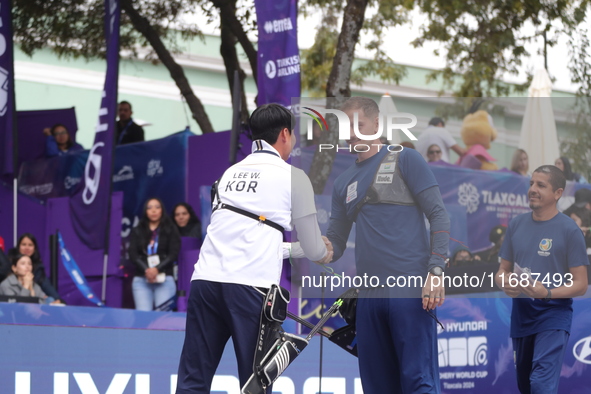 Lee Woo-Seok of Korea and Marcus D'Almeida of Brazil compete during the Men's recurve semifinals match on the final day of the Tlaxcala 2024...