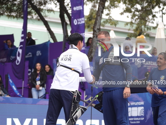 Lee Woo-Seok of Korea and Marcus D'Almeida of Brazil compete during the Men's recurve semifinals match on the final day of the Tlaxcala 2024...