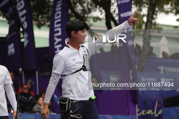 Lee Woo-Seok of Korea competes against Marcus D'Almeida of Brazil (not in picture) during the Men's recurve semifinals match on the final da...