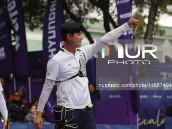 Lee Woo-Seok of Korea competes against Marcus D'Almeida of Brazil (not in picture) during the Men's recurve semifinals match on the final da...