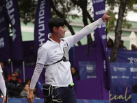 Lee Woo-Seok of Korea competes against Marcus D'Almeida of Brazil (not in picture) during the Men's recurve semifinals match on the final da...