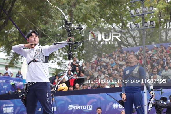 Lee Woo-Seok of Korea and Marcus D'Almeida of Brazil compete during the Men's recurve semifinals match on the final day of the Tlaxcala 2024...