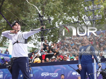 Lee Woo-Seok of Korea and Marcus D'Almeida of Brazil compete during the Men's recurve semifinals match on the final day of the Tlaxcala 2024...