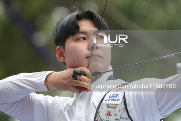 Lee Woo-Seok of Korea competes against Marcus D'Almeida of Brazil (not in picture) during the Men's recurve semifinals match on the final da...