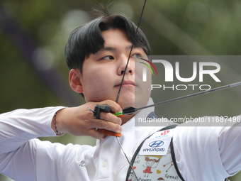 Lee Woo-Seok of Korea competes against Marcus D'Almeida of Brazil (not in picture) during the Men's recurve semifinals match on the final da...