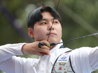 Lee Woo-Seok of Korea competes against Marcus D'Almeida of Brazil (not in picture) during the Men's recurve semifinals match on the final da...