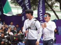 Lee Woo-Seok of Korea competes against Marcus D'Almeida of Brazil (not in picture) during the Men's recurve semifinals match on the final da...